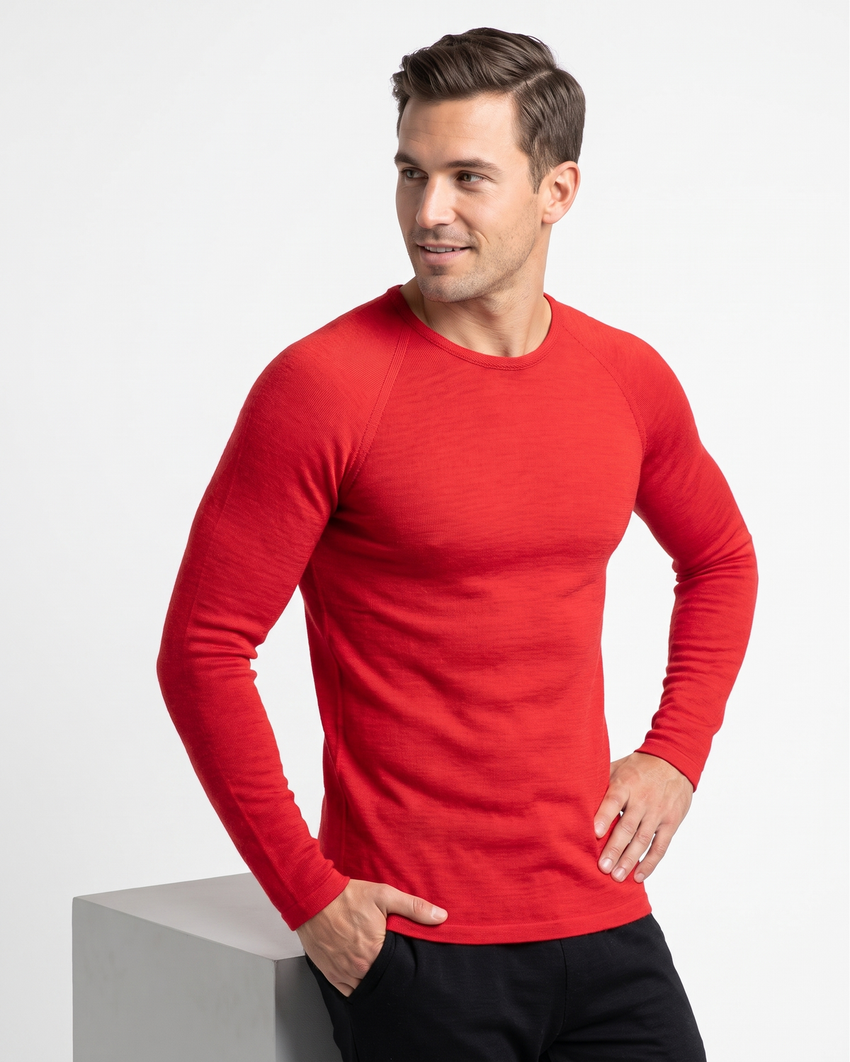 Man wearing a red long-sleeve thermal on a white background
