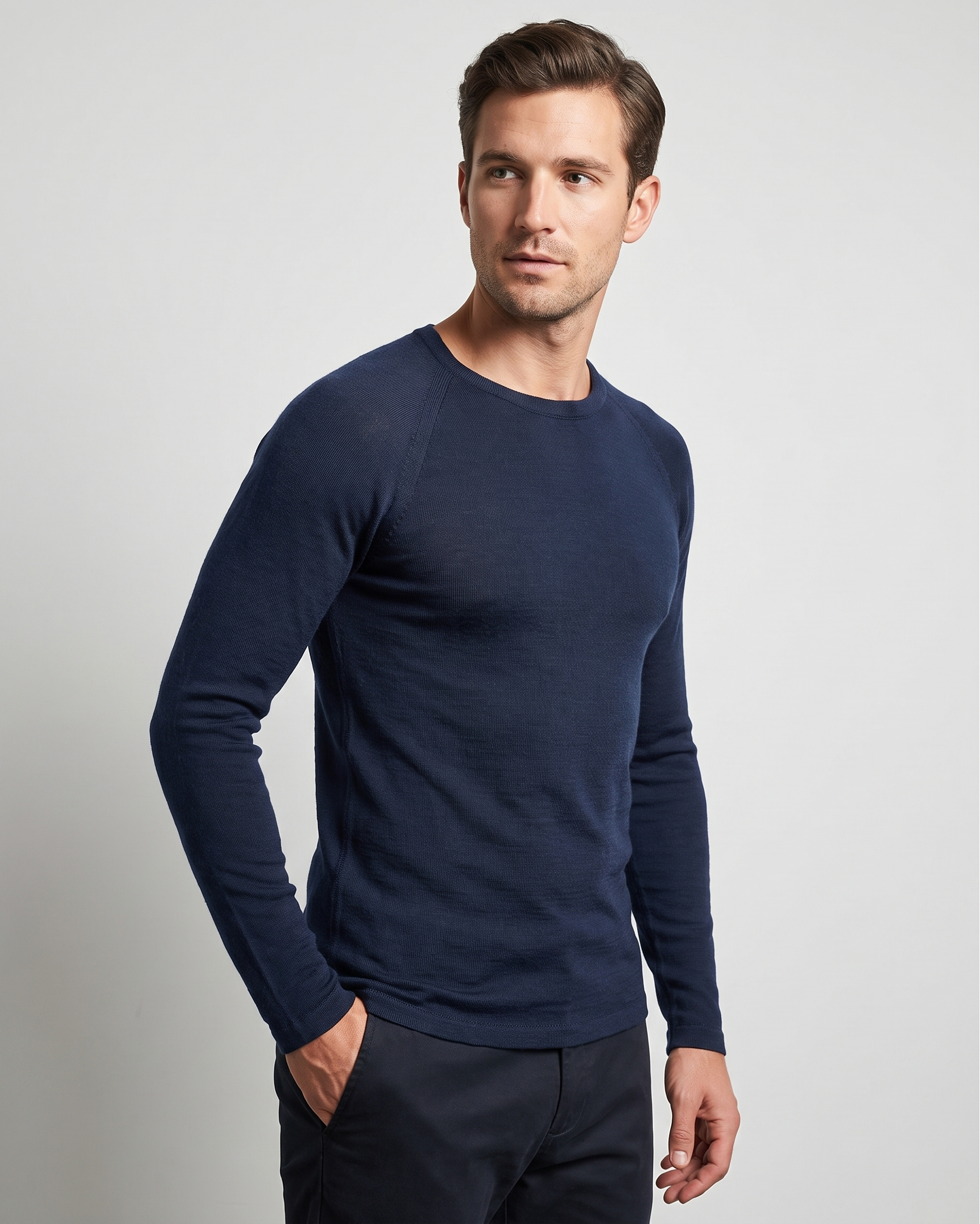 Man wearing a navy blue long-sleeve thermal against a light gray background