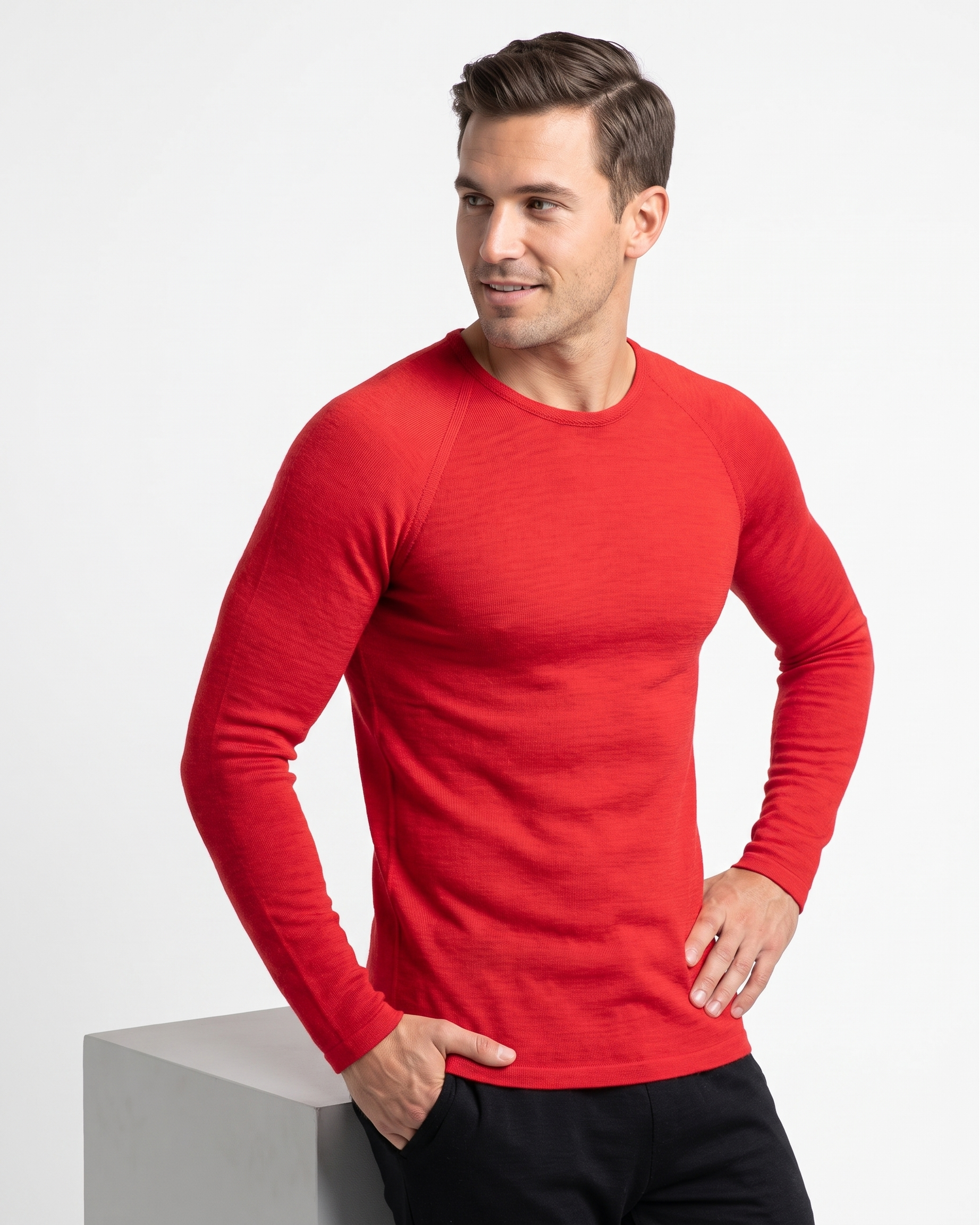 Man wearing a red long-sleeve thermal on a white background