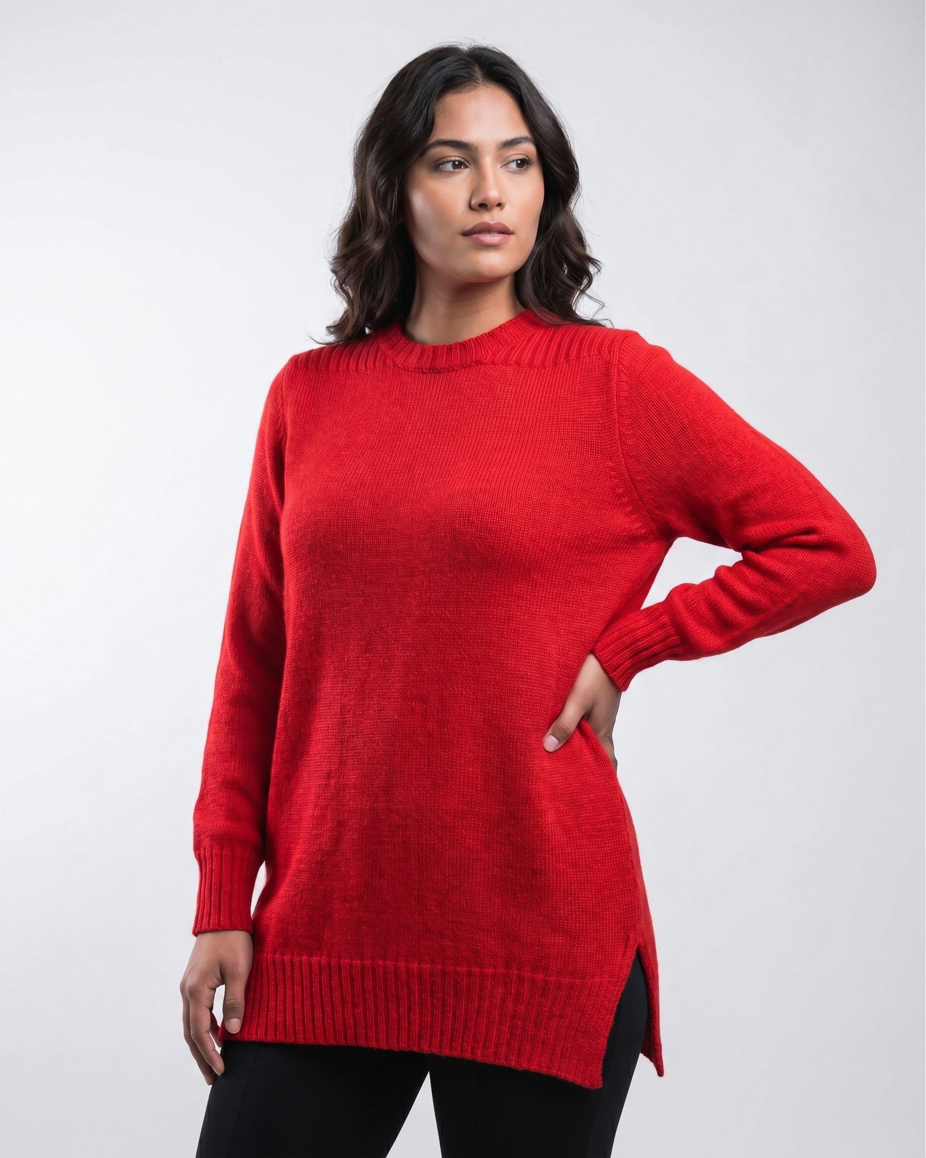 Woman wearing a red tunic sweater on a white background